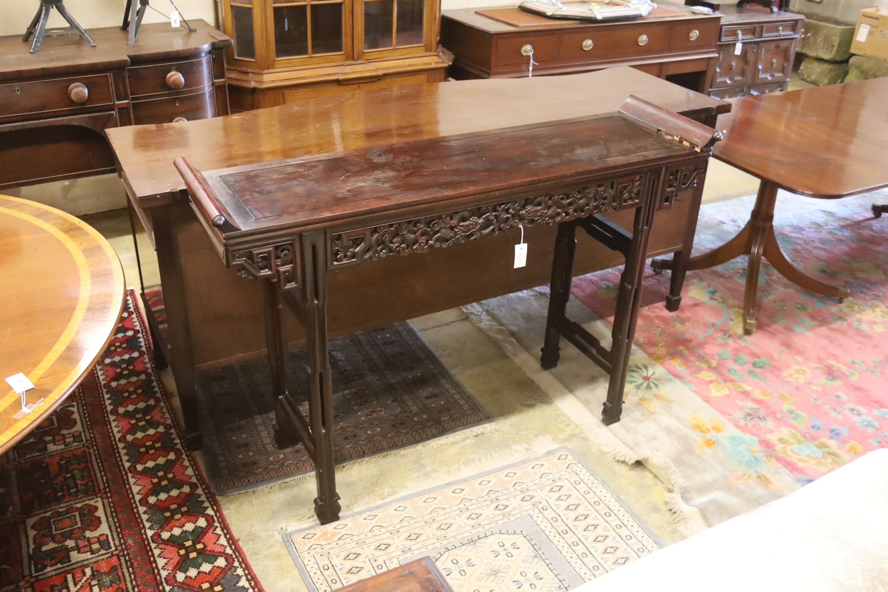 A Chinese altar table, width 150cm, depth 45cm, height 102cm